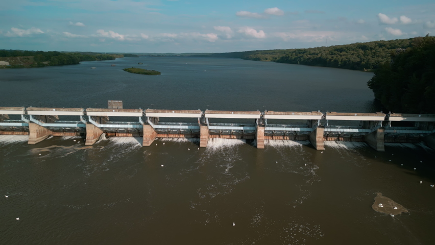 Dam with flowing water on river, Aerial wide view. 