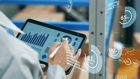 Worker using tablet PC and statistical data. Inventory control. Warehouse management systems. - Powered by Shutterstock - Get 15% off with code: PIKWIZARD15