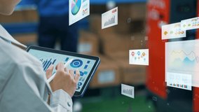 Worker using tablet PC and statistical data. Inventory control. Warehouse management systems. Paperless work. - Powered by Shutterstock - Get 15% off with code: PIKWIZARD15