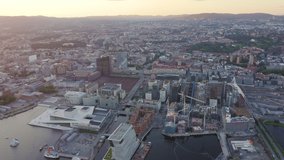Inscription on video. Oslo, Norway. View overlooking the town. Sunset. Aerial view. Different colors letters appears behind small squares, Aerial View, Point of interest