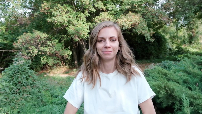 Portrait of a young beautiful woman laughing hysterically at the camera