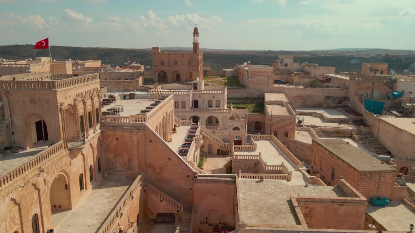 General view of Midyat city with drone, Midyat is a district of Mardin province. The history of Midyat can be traced back to the Hurrians during the 3rd millennium, Turkey. Royalty-Free Stock Footage #1097281235