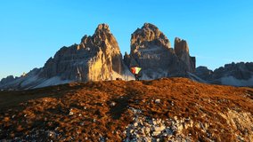 Footage filmed at Rifugio Auronzo, Tri Cine up the mountains in Italian Dolomites. Video of beautifull mountains Tri Cine, filmed at sunrise in 4k with a drone with smoooth movement