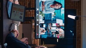 Vertical video: Business team online meeting, remote coworkers videocall discussion. Diverse people talking in teleconference, colleagues brainstorming in videoconference in office zoom in