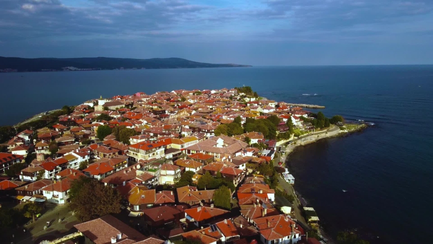 Aerial view of the town of Nessebar in Bulgaria. Beautiful ancient city with tiled roofs. Old town on an island in the Black Sea.