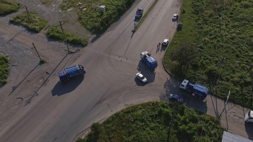 Aerial view garbage trucks drive  | Shutterstock HD Video #1097295211