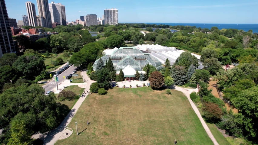 Aerial of botanical conservatory in Chicago, Garfield park Conservatory on sunny day. Aerial.