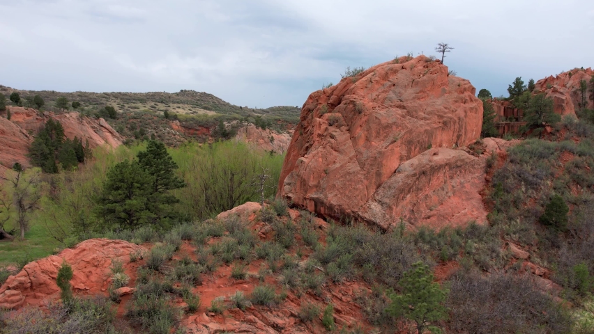Aerial View of Colorado River Through Red Rock Canyon Park Site, Rock Geological Formations Valley With Vegetation and Rocky Hills Mountains Around
