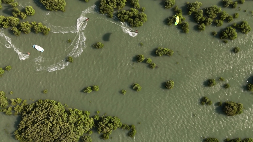 Incredible Cinematic Top Down Drone Shot of Kitesurfers Weaving Between Mangroves in Brazil 