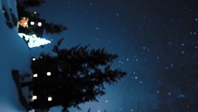 Vertical video. Animated video card. A Christmas tree shines in the center of a small village in the mountains. concept of Christmas celebrating. Place for your text
