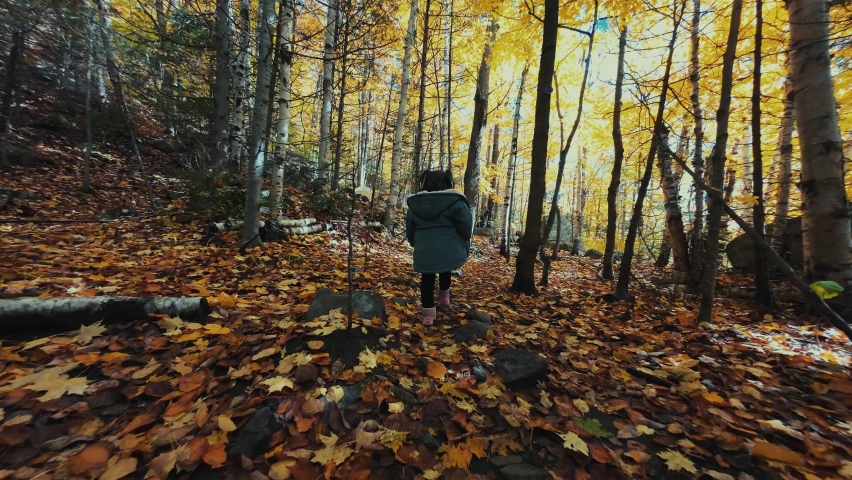 People hiking with beautiful Autumn foliage in Adirondack Upper New York State