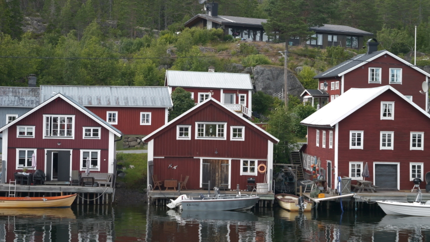 Wooden Red Houses by the water in Bönhamn, Swedish Fishing Village