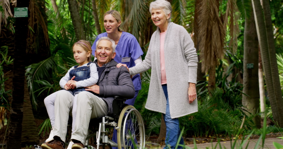 Family, grandmother and grandfather in wheelchair with girl for walk in park, caring and bonding. Support, disability and love of happy grandpa, child and grandma enjoying time together in garden. | Shutterstock HD Video #1097324859
