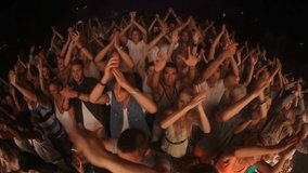 Concert audience, jump and clapping at music event together for live performance, outdoor festival and party celebration. Dancing at techno club, edm dance entertainment and fun crowd in nightclub - Powered by Shutterstock - Get 15% off with code: PIKWIZARD15