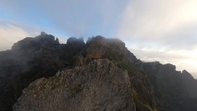 FPV Drone View of Pico de Areiro over the clouds during sunrise