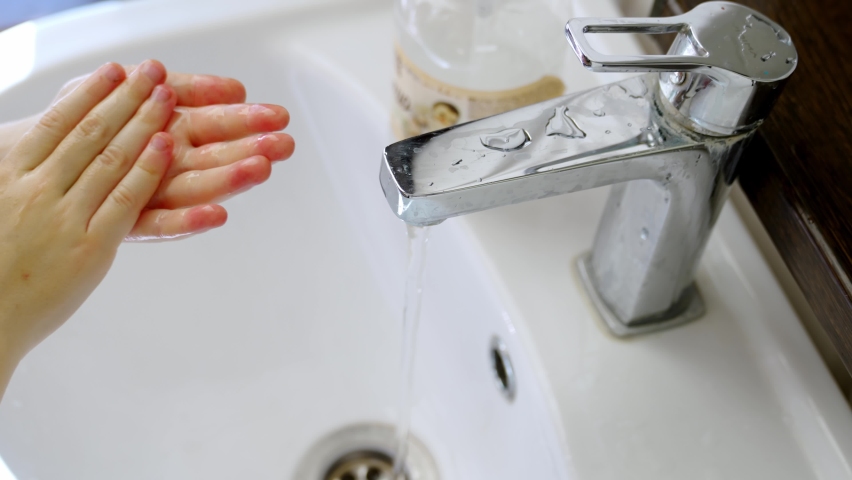 Washing children's hands with soap in the sink. the concept of hygiene in kindergartens and schools. mandatory hand washing before eating and after a walk. | Shutterstock HD Video #1097328869