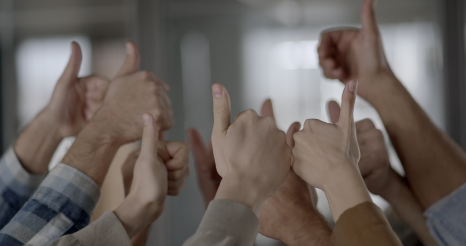 Colleagues raise their thumbs up | Shutterstock HD Video #1097332627