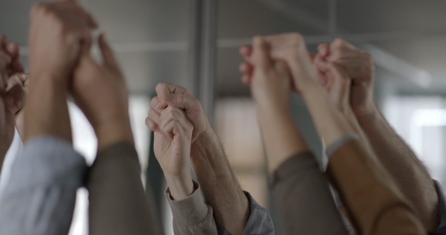 Business colleagues holding their hands in unity | Shutterstock HD Video #1097332629