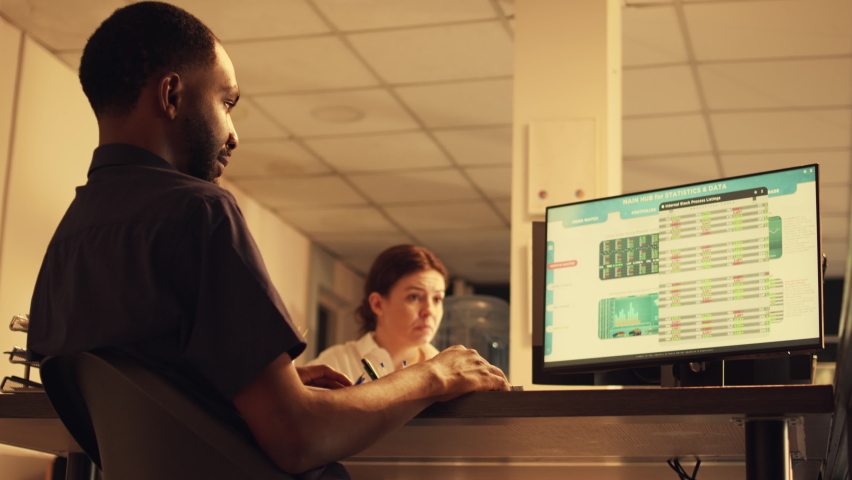 Corporate employee analyzing stock market real time trend and financial exchange statistics on computer. Looking at hedge fund index data to make global investment. Handheld shot.