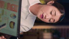 Vertical video: Asian woman talking in business meeting close up, employee speaking, discussing corporate presentation. Coworkers brainstorming, company research analytics report discussion