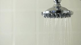 Water pours from shower head Close-up of water drops bathroom concept of washing hygiene daily relax