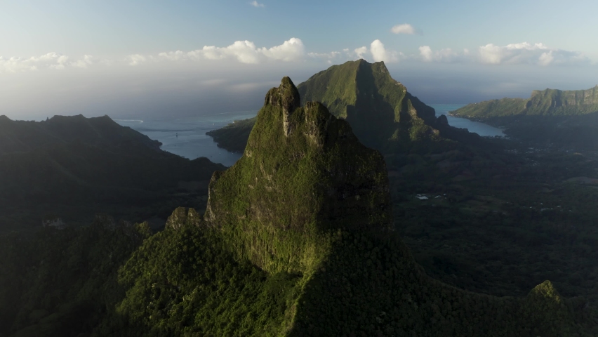 Aerial view of mountains peaks at sunset, Moorea, French Polynesia. Royalty-Free Stock Footage #1097343705