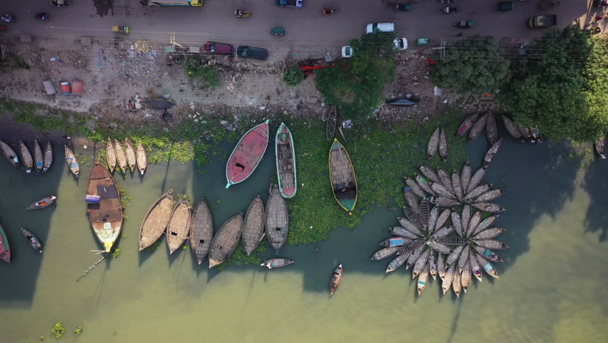 Aerial view of traditional fishing boats along Buriganga river in Keraniganj, Dhaka, Bangladesh.