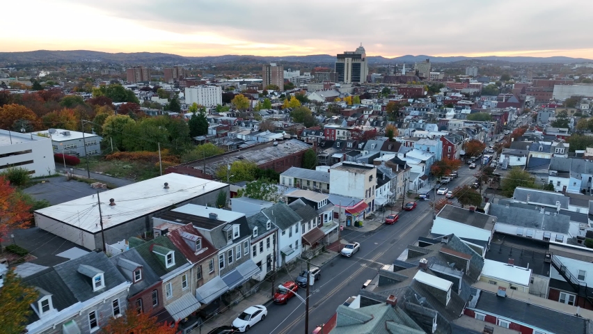 American city in autumn. Evening light. Aerial above poor residential housing district. Houses and homes in autumn.