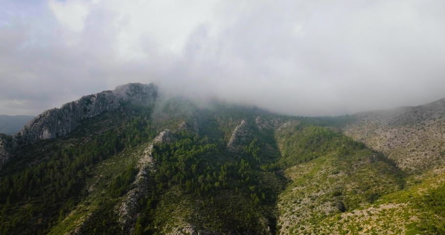 Beautiful rocky mountain landscape in summer, cloudy sky. Spain