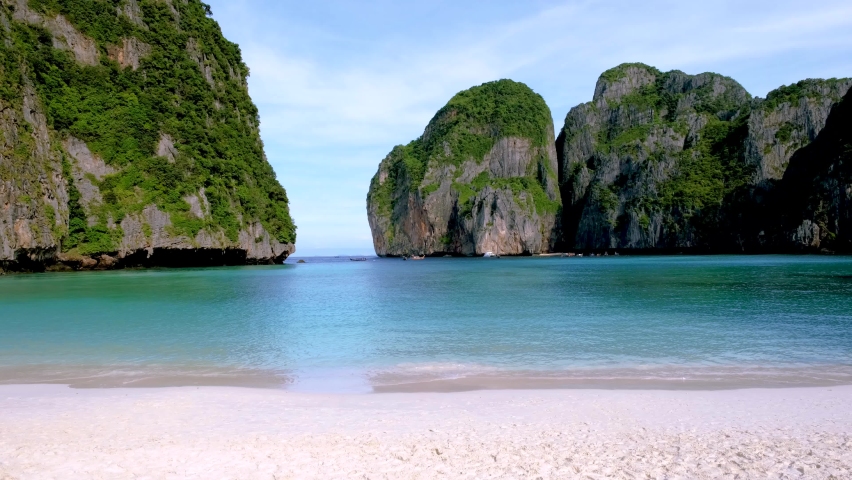 Tropical beach bay at Koh Phi Phi Thailand empty Maya beach in the early morning with no tourist on the beach | Shutterstock HD Video #1097364619