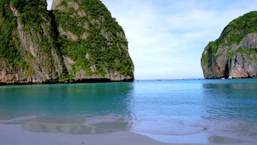 Tropical beach bay at Koh Phi Phi Thailand empty Maya beach in the early morning with no tourist on the beach | Shutterstock HD Video #1097364647