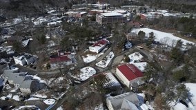 Drone shot of residential in rural area in winter in Beverly, Massachusetts, USA