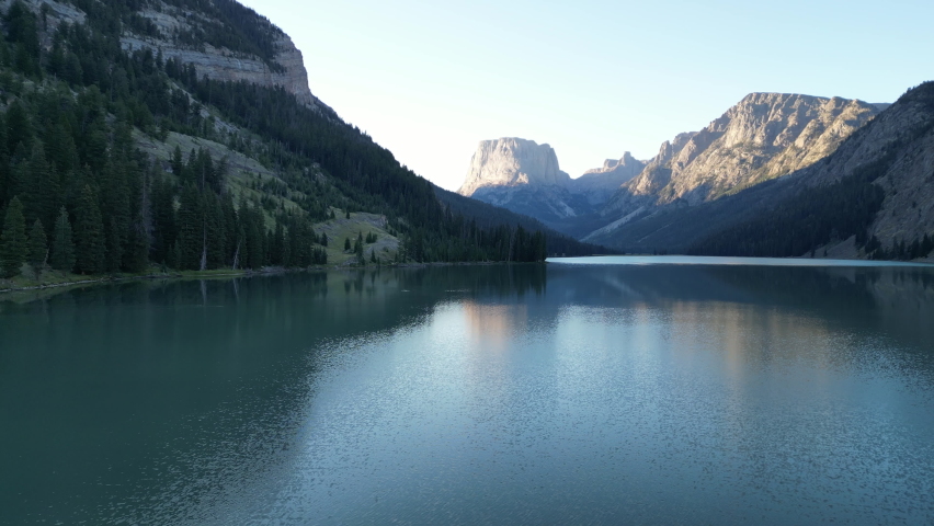Fly Over Tranquil Water With Mirror Reflection On Green River Lakes In Wyoming. Aerial Drone Shot