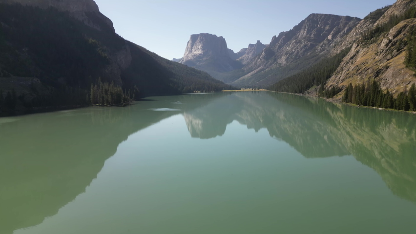 Mirror Reflection Over Idyllic Water With Mountain Range Background In Lower Green River Lake, Wyoming. Aerial Shot
