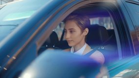 Cinematic storytelling corporate video about a young business woman working in a futuristic city.	Businesswoman driving an elegant business car