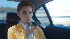 Cinematic storytelling corporate video about a young business woman working in a futuristic city.Businesswoman sitting on the back seat of an elegant business car