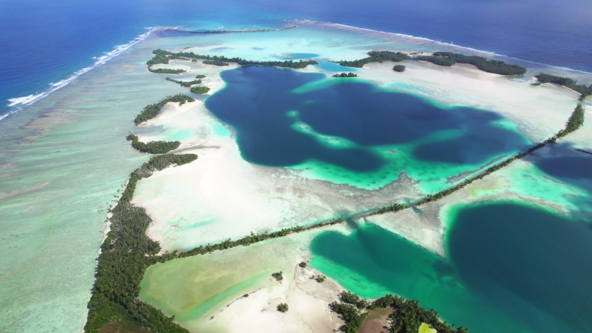 Aerial shot of tropical atoll , lagoon, man-made islands and causeways at Palmyra Atoll Royalty-Free Stock Footage #1097377119
