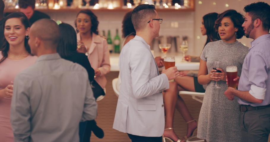 Friends, happy and social at party, event or celebration for drinks, champagne or wine together. Diversity, office or staff party for happiness, networking and drinking or talking at night Royalty-Free Stock Footage #1097378223