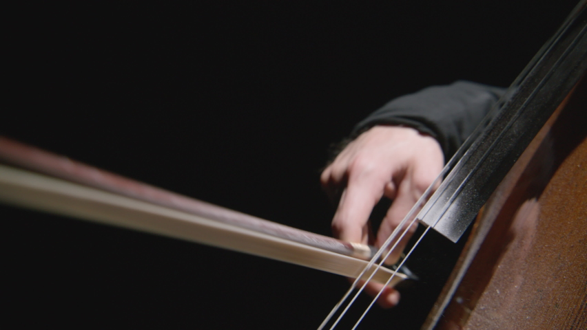 Footage of male hands playing cello violoncello . Musician man plays in beautiful contrabass on stage in concert . Close up . Shot on Red Komodo movie camera | Shutterstock HD Video #1097379169