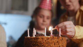 kid birthday. little girl blows out the candles on the cake in a dream circle of happy family. celebration birthday kid concept. friendly happy family celebrating birthday a lot of people - Powered by Shutterstock - Get 15% off with code: PIKWIZARD15