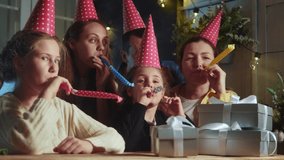 kid birthday. dream little girl blows out the candles on the cake in a circle of happy family. birthday celebration kid concept. friendly happy family celebrating birthday a lot of people - Powered by Shutterstock - Get 15% off with code: PIKWIZARD15