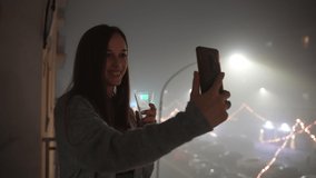 New year eve celebration party, smiling woman with champagne glass in hands giving congratulations to her family and friends through the online video call, cheerful female on amazing festive