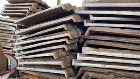 Stack of demolished red clay roof tiles outdoor, weathered ceramic shingle unusable for covering house roof, construction site garbage ready for recycle. Dismantling ruined terracotta roof tiles - Powered by Shutterstock - Get 15% off with code: PIKWIZARD15