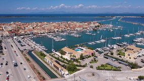 Aerial drone video of famous marina of Lefkada island town with anchored yachts and sail boats, Ionian, Greece