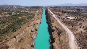 Aerial drone video of narrow Corinth canal of Isthmus from West submersible bridge and narrow opening of Corinthian gulf to Saronic gulf, Loutraki, Greece