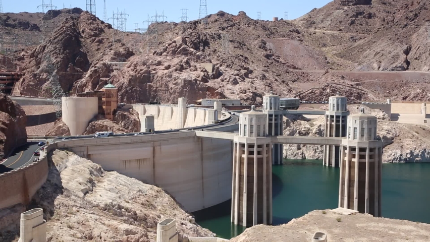 Hoover Dam and penstock towers in Colorado river at Nevada and Arizona border, USA | Shutterstock HD Video #1097385165
