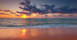 Beautiful morning over tropical beach. Ocean or sea sunrise with scenic clouds.