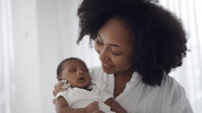 Close up portrait of beautiful young African American mother holding kissing sleep newborn baby in hospital. Healthcare medical love black afro woman lifestyle mother's day, breast concept  - Powered by Shutterstock - Get 15% off with code: PIKWIZARD15