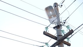 street old lamp with wires and electricity. lamppost for street lighting close-up. lamp in the lantern on the pole. lightning high voltage concept current electricity - Powered by Shutterstock - Get 15% off with code: PIKWIZARD15
