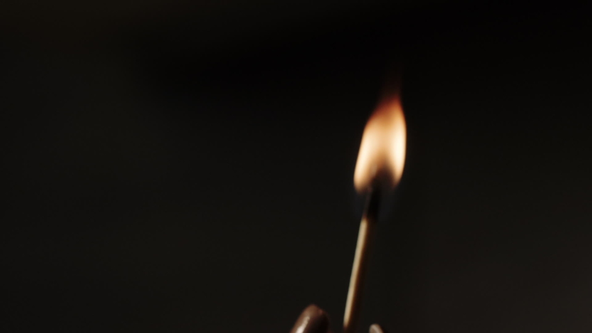 Match flame burning isolated on black background. Media. Wooden stick burns and blows with smoke. Slow motion | Shutterstock HD Video #1097390255